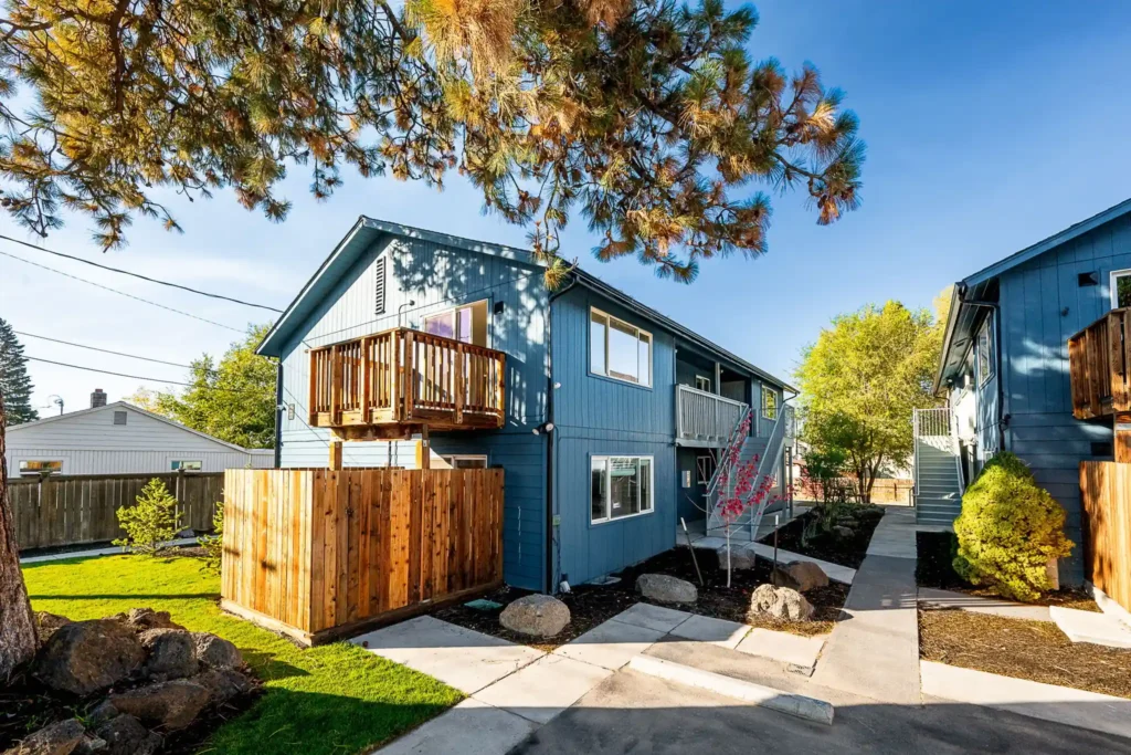Renovated apartment community in Bend, Oregon featuring updated exterior finishes, private patios, landscaping improvements, and professionally managed rental units.